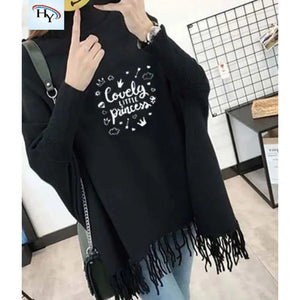 Black poncho with 'Lovely little princess' text and tassels, worn by a person.
