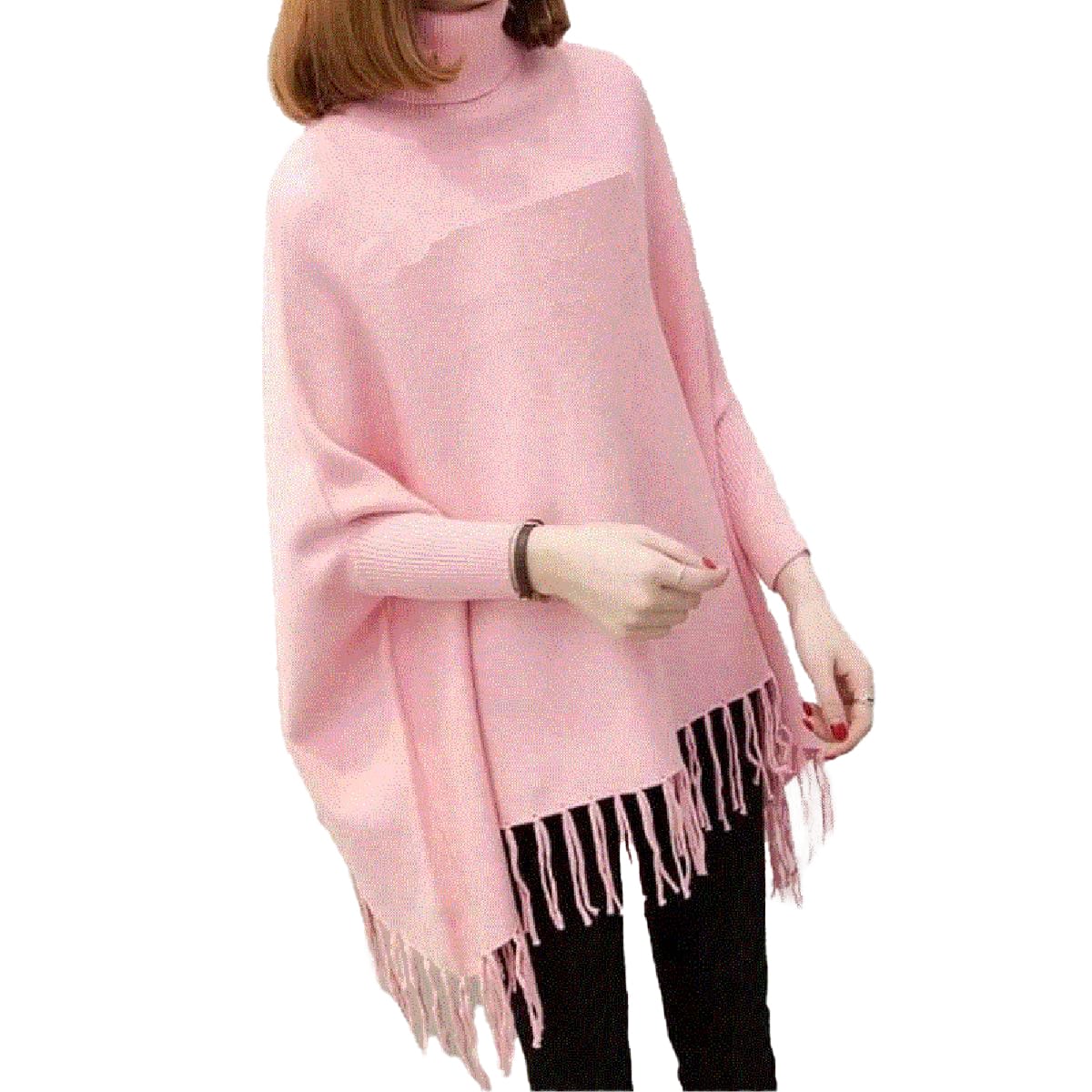 Person wearing a pink poncho with fringe details on a white background